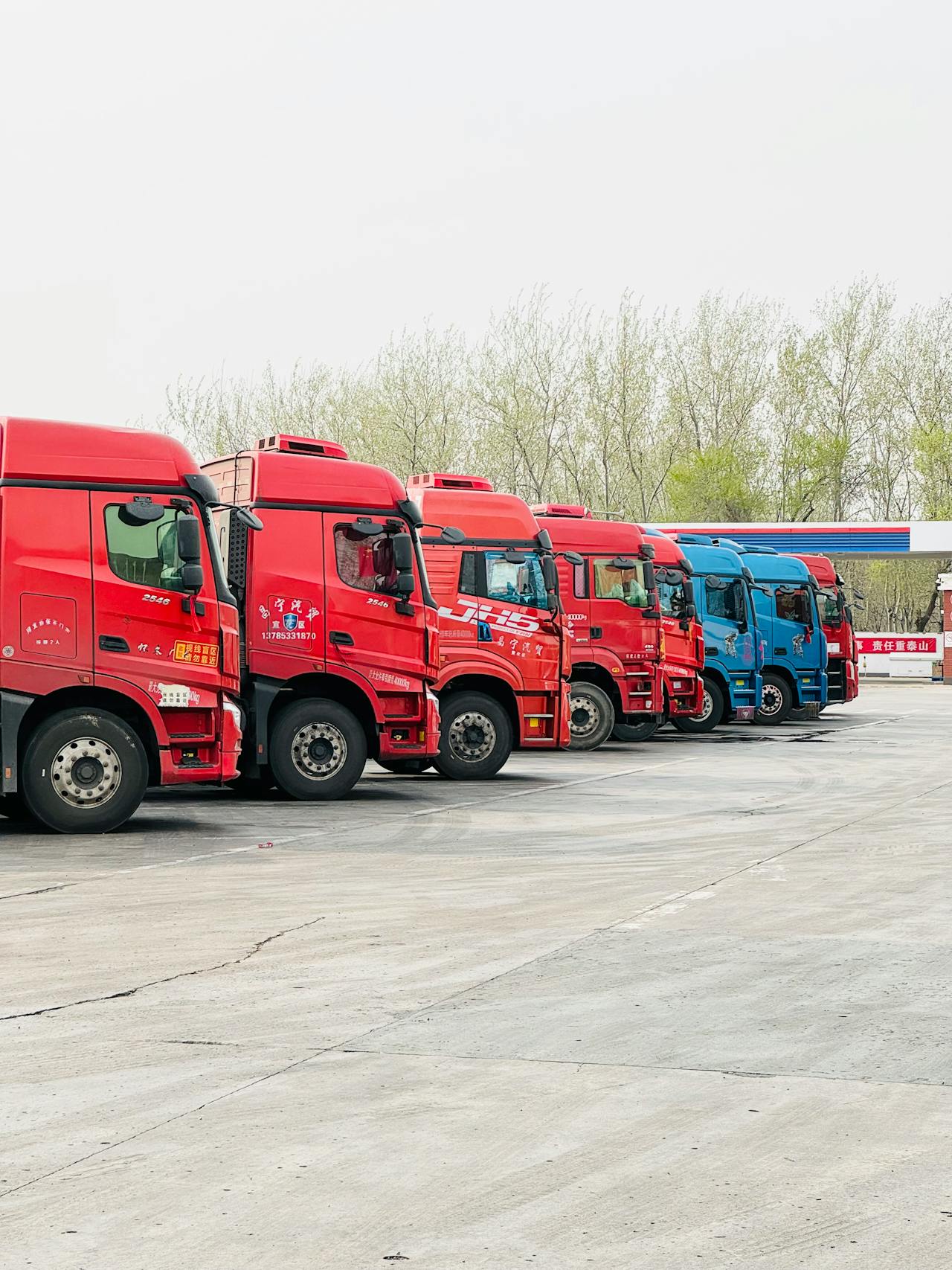 Truck fleet on highway at night